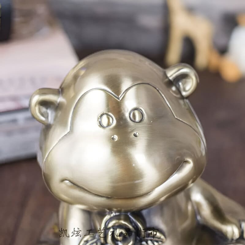 singe tirelire bronze
